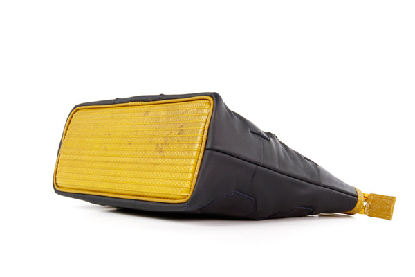 Elvis & Kresse Fire & Hide Cosmetics Case in Blue with yellow fire hose at Supernomad