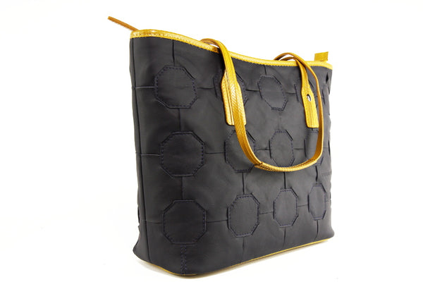 Elvis & Kresse Fire & Hide Tote Bag in Blue with yellow hose at Supernomad