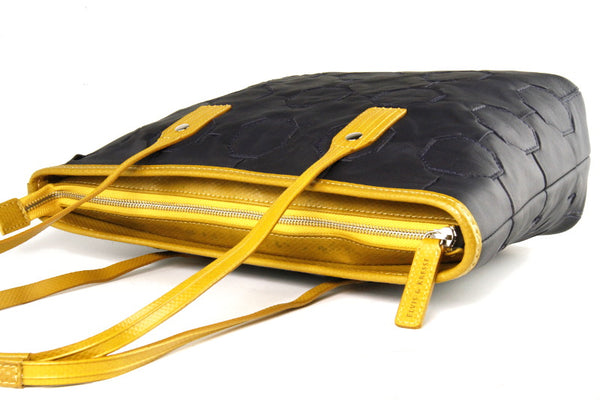 Elvis & Kresse Fire & Hide Tote Bag in Blue with yellow hose at Supernomad